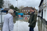 Gareth discussing the impacts of recent flooding in Chalfont St. Peter with local resident